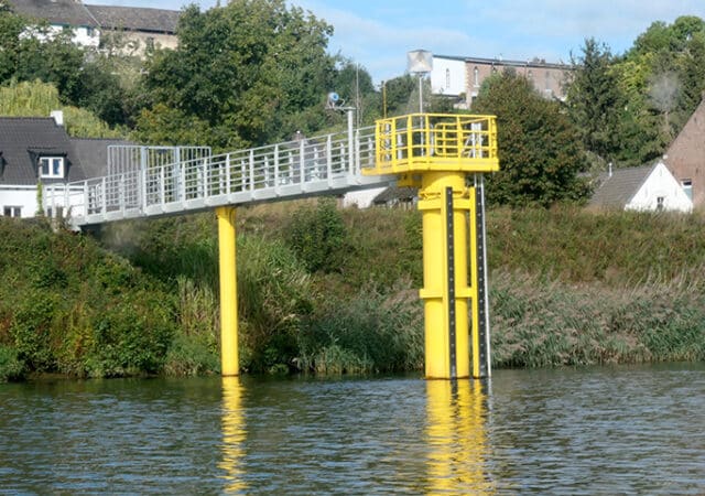 the farmer and great measuring pole with walkway in the maas near maastricht.